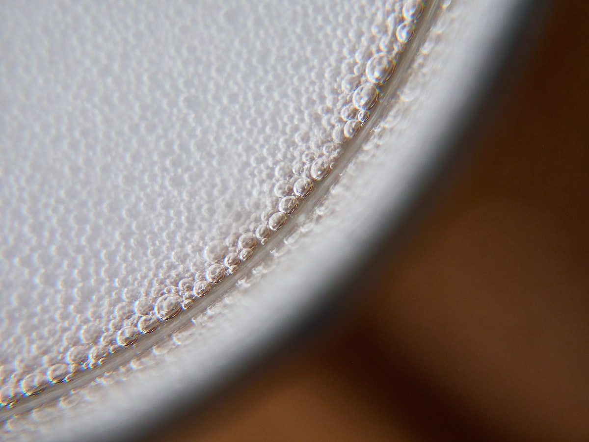 white round plate on brown wooden table